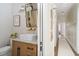 Bright bathroom features a modern sink, marble countertop, stylish fixtures, and a framed mirror at 2412 W Prospect Rd, Tampa, FL 33629