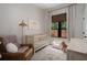 Comfortable Bedroom includes a crib, rocking chair, and natural light, creating a serene environment at 2412 W Prospect Rd, Tampa, FL 33629