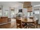 Cozy dining area open to the living room, boasting natural light and comfortable seating for Gathering gatherings at 2412 W Prospect Rd, Tampa, FL 33629