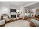Bright living room features a modern fireplace, cozy seating, and an open floor plan for easy entertaining at 2412 W Prospect Rd, Tampa, FL 33629