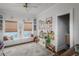 Bright playroom with built-in shelves, a play kitchen, and a cozy window seat at 2412 W Prospect Rd, Tampa, FL 33629