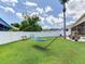 Expansive backyard with well-maintained lawn, offering ample space for outdoor activities at 24811 Gun Smoke Dr, Land O Lakes, FL 34639