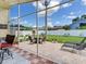 Enjoy the view of the fenced in backyard, featuring a spacious patio with outdoor seating at 24811 Gun Smoke Dr, Land O Lakes, FL 34639