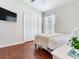 Bedroom with TV, ceiling fan, and large closet, offering comfort and functionality at 24811 Gun Smoke Dr, Land O Lakes, FL 34639