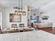 Open-concept dining room flows into a living area, creating an inviting space for entertaining at 24811 Gun Smoke Dr, Land O Lakes, FL 34639