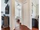 Hallway offers a glimpse into the bedroom and features a convenient laundry area for added functionality at 24811 Gun Smoke Dr, Land O Lakes, FL 34639