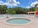 Inviting community hot tub with a serene pool view and a fenced perimeter for added privacy at 24811 Gun Smoke Dr, Land O Lakes, FL 34639