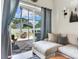 Cozy living room with lots of natural light and a sliding door to the patio at 24811 Gun Smoke Dr, Land O Lakes, FL 34639