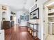 Spacious living room with lots of natural light, next to the laundry room at 24811 Gun Smoke Dr, Land O Lakes, FL 34639
