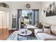 Bright living room featuring hardwood floors with a sliding glass door to the patio at 24811 Gun Smoke Dr, Land O Lakes, FL 34639
