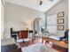 Well-lit home office space featuring a desk, Pilates machine, and serene backyard views at 24811 Gun Smoke Dr, Land O Lakes, FL 34639