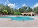 Gorgeous community pool with a spacious deck, perfect for relaxation and outdoor enjoyment at 24811 Gun Smoke Dr, Land O Lakes, FL 34639