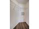 Small walk-in closet area with wood-look flooring and wire shelving at 2691 Saddlewood Ln, Palm Harbor, FL 34685