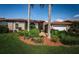 Landscaped yard leading to the front door of this attractive one-story home at 2691 Saddlewood Ln, Palm Harbor, FL 34685