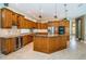 Gourmet kitchen with custom cabinets, granite countertops and stainless steel appliances at 2691 Saddlewood Ln, Palm Harbor, FL 34685