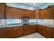 Spacious kitchen with custom cabinets, backsplash and granite countertops at 2691 Saddlewood Ln, Palm Harbor, FL 34685