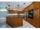 Spacious kitchen with granite countertops, island and stainless steel appliances at 2691 Saddlewood Ln, Palm Harbor, FL 34685