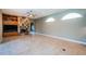 Comfortable living room featuring tile floors, custom fireplace, and an open floor plan at 2691 Saddlewood Ln, Palm Harbor, FL 34685