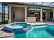 Lovely in-ground pool and spa area with bar at 2691 Saddlewood Ln, Palm Harbor, FL 34685