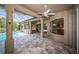 Outdoor entertaining space with a bar overlooking pool and water at 2691 Saddlewood Ln, Palm Harbor, FL 34685