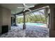 Beautiful screened pool area with pavers and ceiling fans at 2691 Saddlewood Ln, Palm Harbor, FL 34685