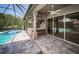 Outdoor bar seating by the pool and jacuzzi, for entertaining at 2691 Saddlewood Ln, Palm Harbor, FL 34685