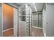 Well-organized walk-in closet featuring custom shelving, drawers, and hanging rods for easy storage at 2691 Saddlewood Ln, Palm Harbor, FL 34685