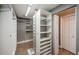 Walk-in closet featuring built-in shelving and storage solutions for optimal organization at 2691 Saddlewood Ln, Palm Harbor, FL 34685