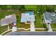 Aerial view of a cozy home with a private screened-in pool and fenced yard at 2914 Forest Cir, Seffner, FL 33584