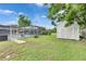 Large backyard with screened pool, patio area, and convenient storage shed at 2914 Forest Cir, Seffner, FL 33584