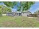Fenced in backyard featuring an in-ground pool, patio and mature trees at 2914 Forest Cir, Seffner, FL 33584