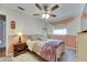 Charming bedroom featuring soft lighting, a bed with nightstand, and a window at 2914 Forest Cir, Seffner, FL 33584