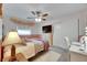 Cozy bedroom with a ceiling fan, TV, and a comfortable bed with night stand at 2914 Forest Cir, Seffner, FL 33584