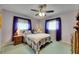 Cozy bedroom with a ceiling fan, comfortable bed, and bright natural light at 2914 Forest Cir, Seffner, FL 33584