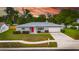 Charming one-story home with a well-manicured lawn and a bright red front door at 2914 Forest Cir, Seffner, FL 33584
