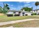 Well-maintained single-story home with a tidy front yard and attached garage at 2914 Forest Cir, Seffner, FL 33584