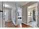 Hallway view showcasing hardwood floors and access to the bedroom and bathroom at 2914 Forest Cir, Seffner, FL 33584