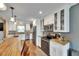 Updated kitchen with stainless steel appliances, breakfast bar, and white cabinets at 2914 Forest Cir, Seffner, FL 33584