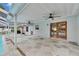 Covered patio featuring ceiling fans, stone flooring and French doors to pool at 2914 Forest Cir, Seffner, FL 33584
