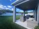 Back patio featuring outdoor seating area and grill, perfect for entertaining at 33191 Azalea Ridge Dr, Wesley Chapel, FL 33545