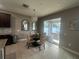 Breakfast nook with chandelier lighting, with patio access to outdoor seating at 33191 Azalea Ridge Dr, Wesley Chapel, FL 33545