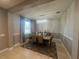 An elegant chandelier hangs over the table and chairs at 33191 Azalea Ridge Dr, Wesley Chapel, FL 33545