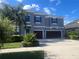 Charming two-story home featuring a well-maintained yard and a convenient two-car garage at 33191 Azalea Ridge Dr, Wesley Chapel, FL 33545