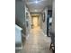 Inviting tiled hallway featuring neutral walls, leading to the home's entrance and other living areas at 33191 Azalea Ridge Dr, Wesley Chapel, FL 33545