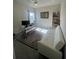 Bright home office featuring a large window, functional desk setup, and comfortable seating for work at 33191 Azalea Ridge Dr, Wesley Chapel, FL 33545