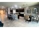 Open concept kitchen with granite countertops, stainless steel appliances, and a breakfast bar with seating at 33191 Azalea Ridge Dr, Wesley Chapel, FL 33545