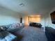 Bright and spacious living room with plush carpeting, comfortable seating, and recessed lighting for a cozy atmosphere at 33191 Azalea Ridge Dr, Wesley Chapel, FL 33545