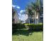 Well-manicured side yard with lush green grass and hedges, offering privacy and space at 33191 Azalea Ridge Dr, Wesley Chapel, FL 33545