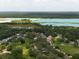 Expansive aerial shot featuring a residential community near large lakes and ample green spaces for recreation at 35077 Whispering Oaks Blvd, Dade City, FL 33523