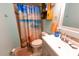 Bathroom featuring decorative shower curtain, vanity, and updated fixtures at 35077 Whispering Oaks Blvd, Dade City, FL 33523